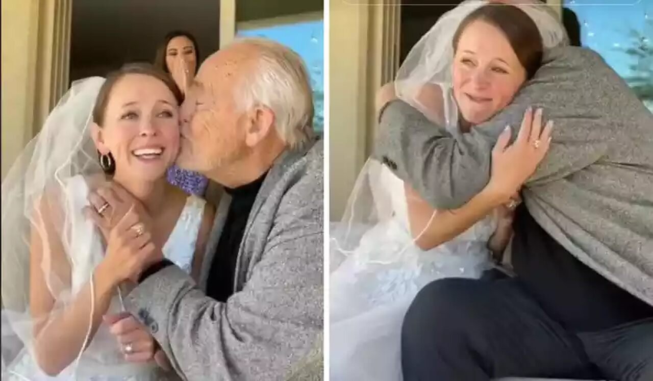 Na imagem, um pai e uma filha, vestida de noiva, se abraçam - Metrópoles